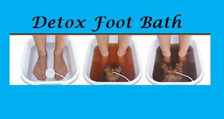 A person is getting foot bath with the help of a device.