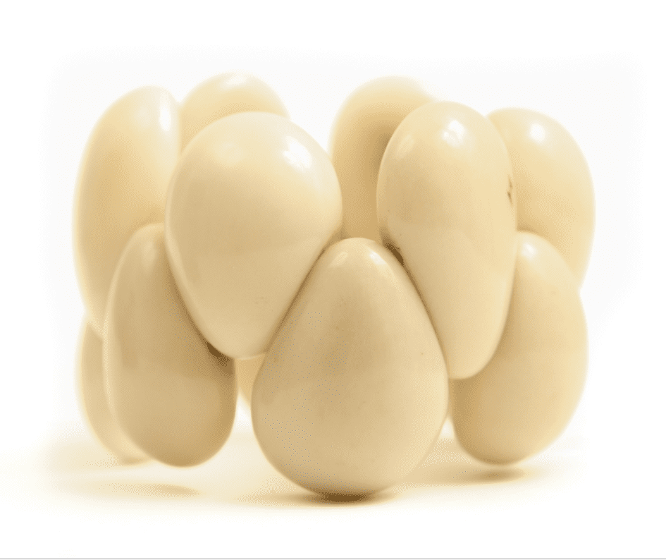 A group of white eggs sitting on top of each other.
