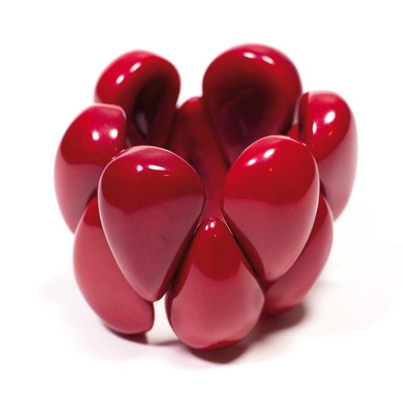 A red object is sitting on top of the table.